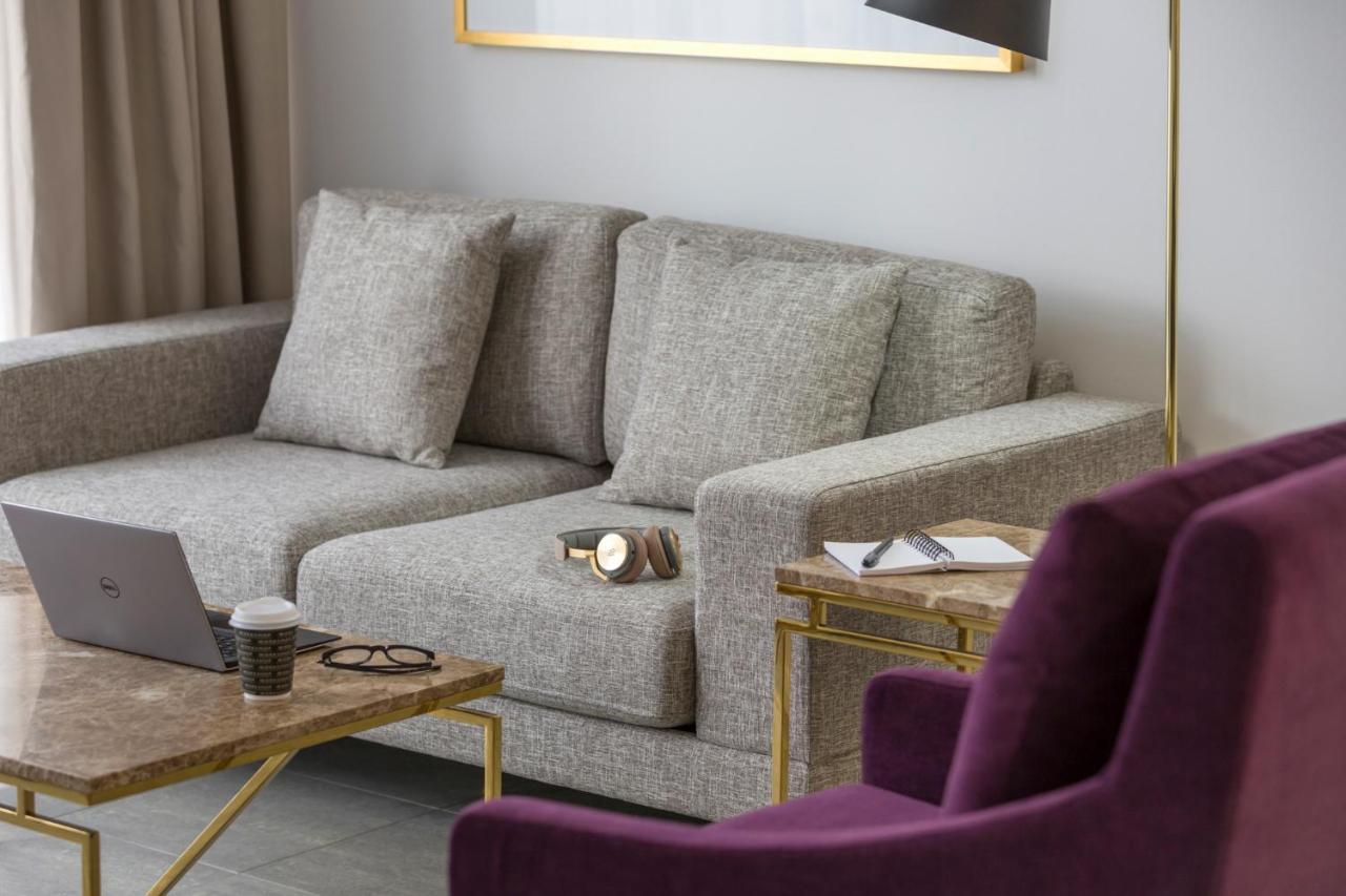Meriton Suites Pitt Street, Sydney Exterior foto A sofa
