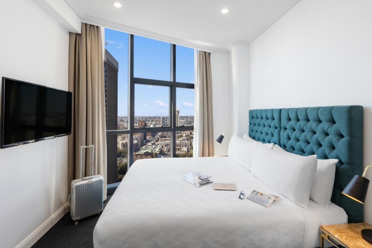Meriton Suites Pitt Street, Sydney Exterior foto A bedroom at the hotel