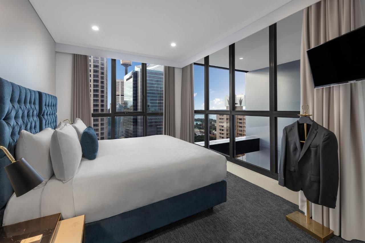 Meriton Suites Pitt Street, Sydney Exterior foto A bedroom at the hotel